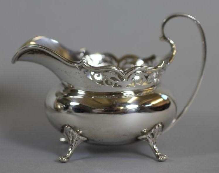 A COMPOSITE SILVER FOUR PIECE TEA AND COFFEE SERVICE Image