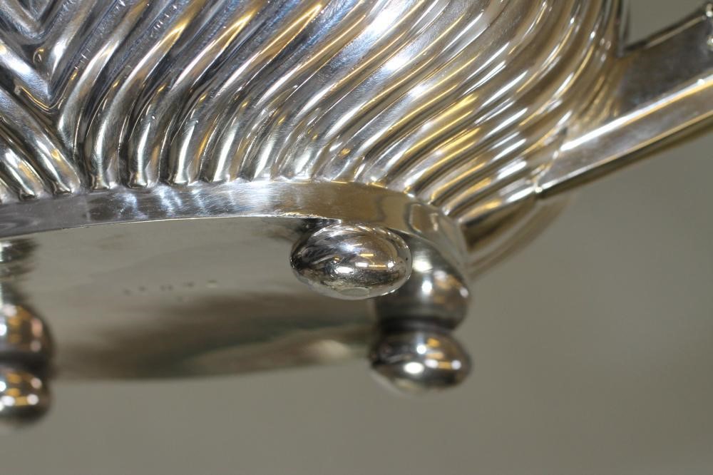 A MATCHED THREE PIECE SILVER TEA SERVICE Image