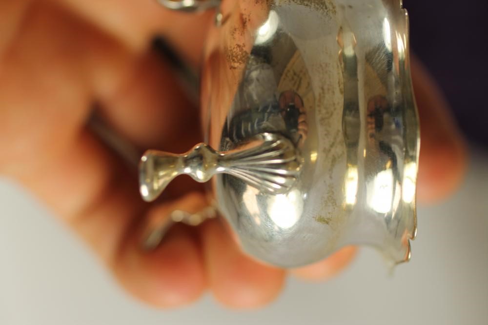 A MATCHED THREE PIECE SILVER TEA SERVICE Image