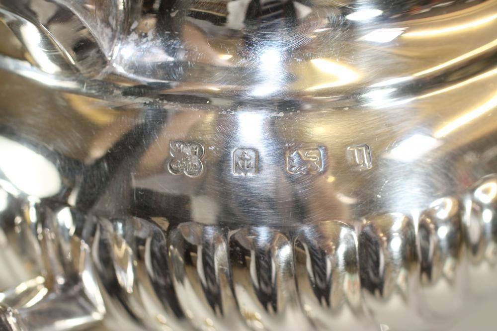 A MATCHED THREE PIECE SILVER TEA SERVICE Image