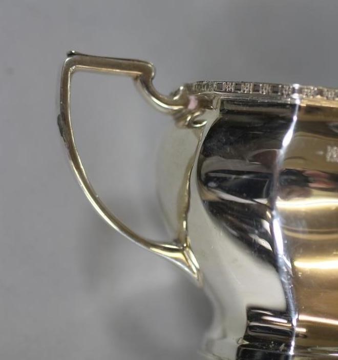 A THREE PIECE SILVER TEA SERVICE Image