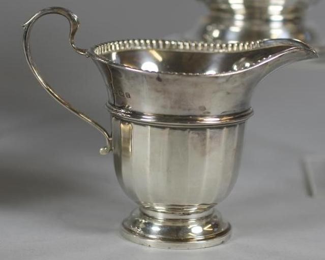 A FOUR PIECE SILVER TEA AND COFFEE SERVICE Image