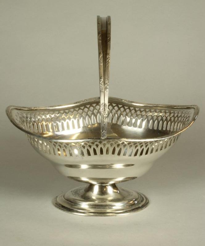 A SMALL SILVER BASKET Image