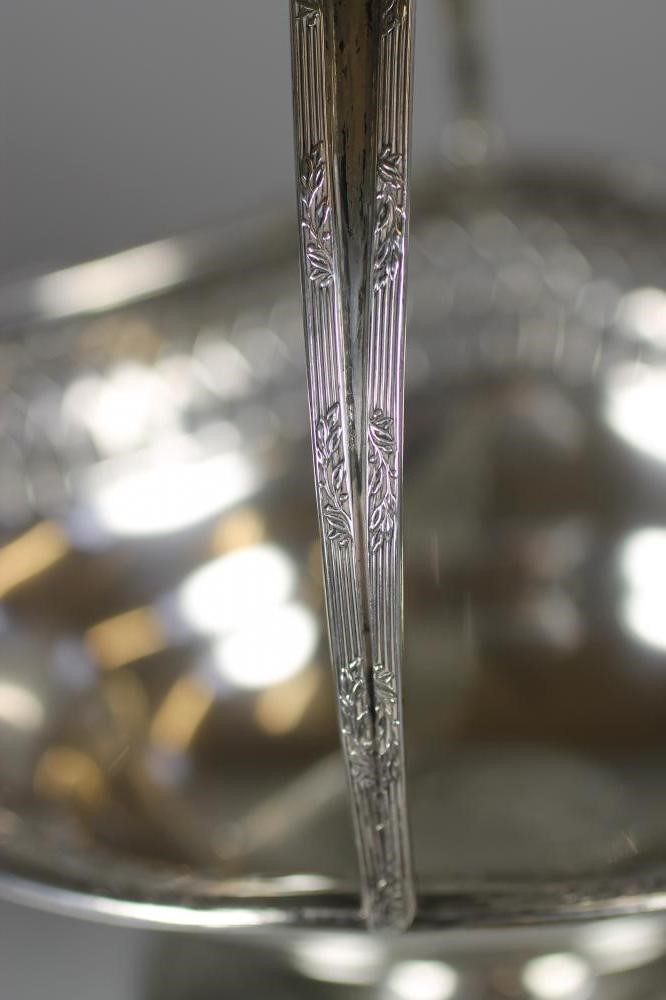 A SMALL SILVER BASKET Image