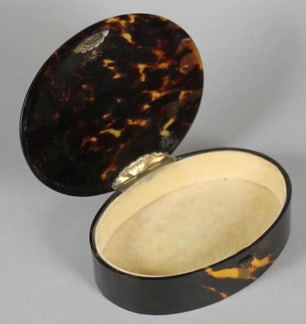 AN ART DECO TORTOISESHELL DRESSING TABLE BOX of oval form Image