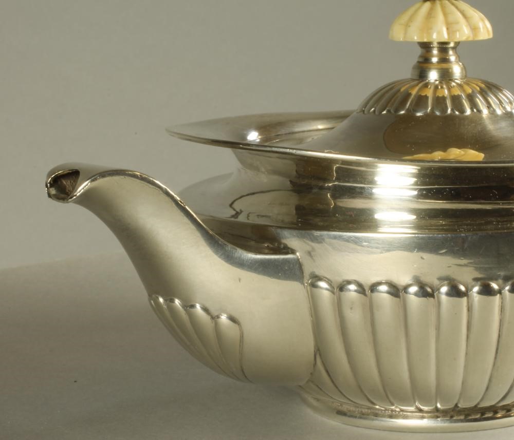 A LATE VICTORIAN SMALL SILVER TEAPOT Image