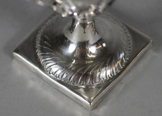 A LATE GEORGE III SILVER PEDESTAL HELMET MILK JUG Image