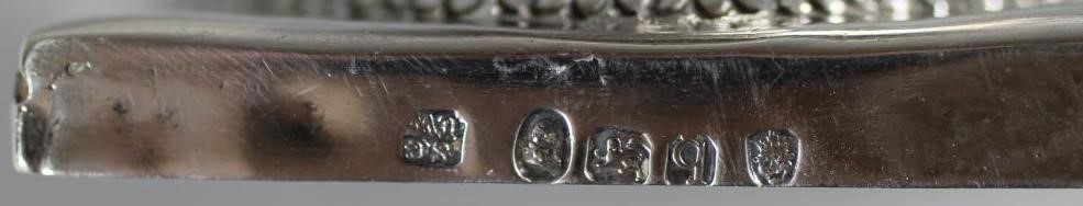 A LATE GEORGE III SILVER PEDESTAL HELMET MILK JUG Image