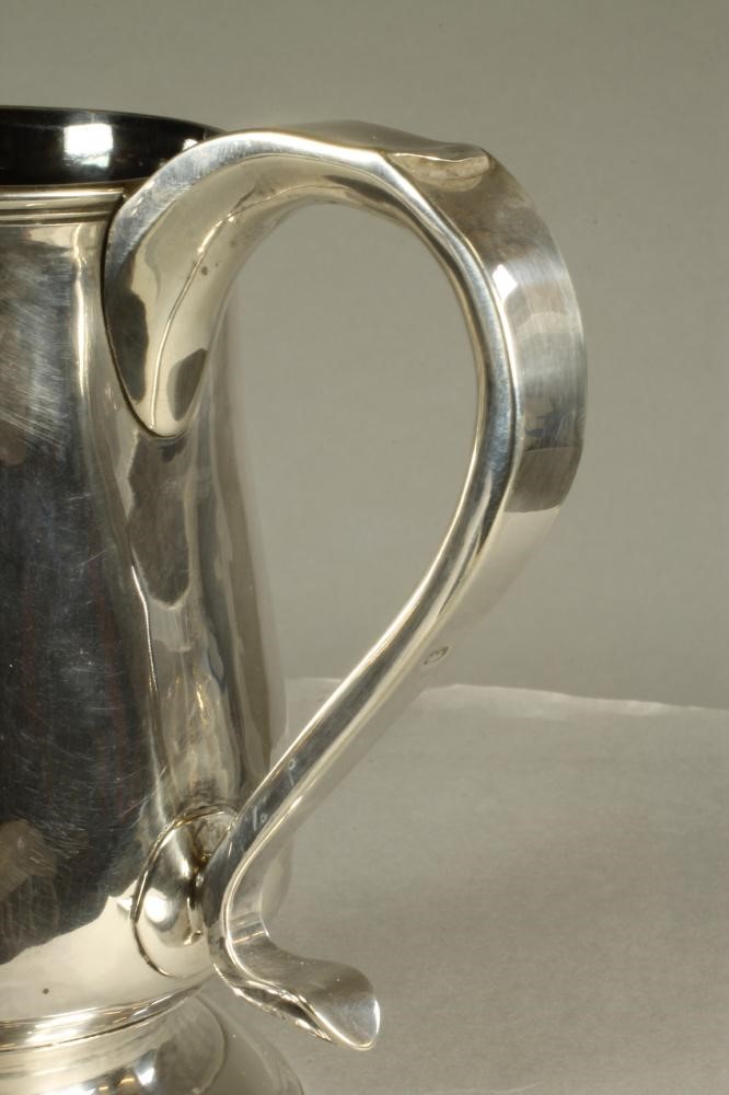 A LATE GEORGE III SILVER MUG Image