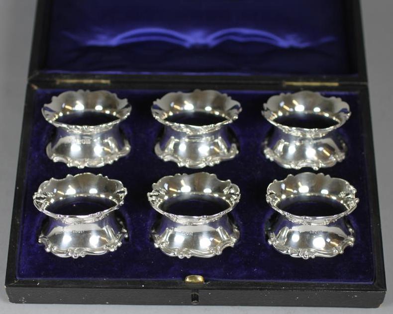 A SET OF SIX EDWARDIAN SILVER NAPKIN RINGS Image
