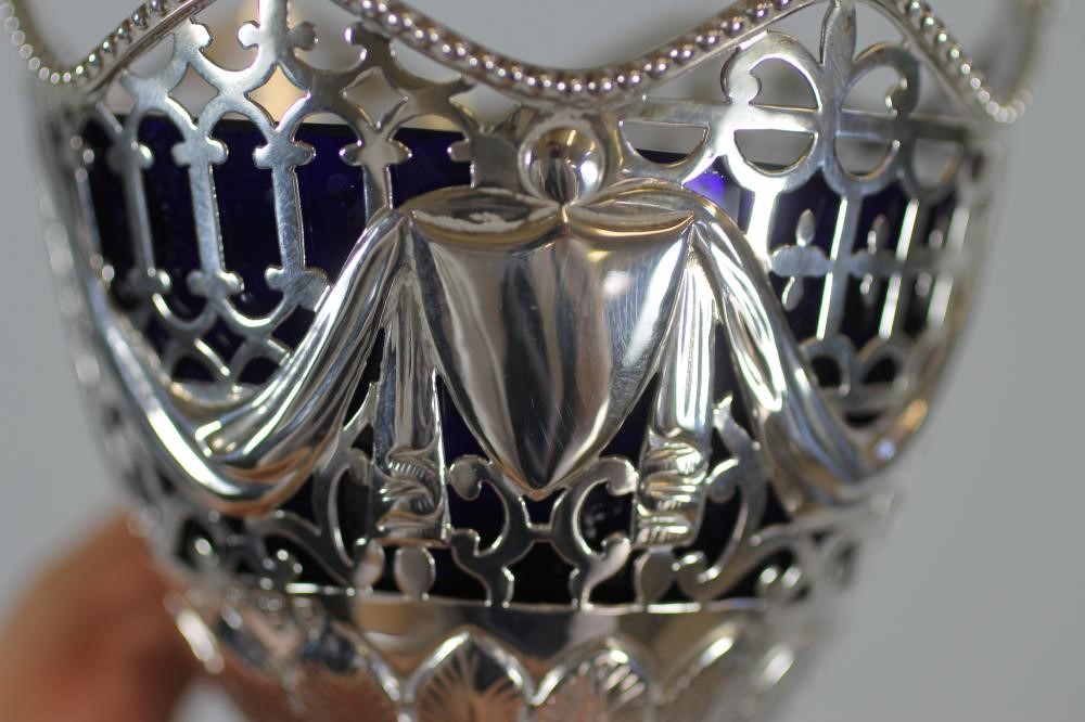 A LATE VICTORIAN SILVER SUGAR BASKET Image