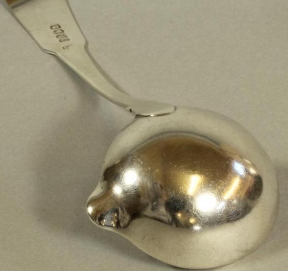 A GEORGE IV SILVER CHEESE SCOOP Image