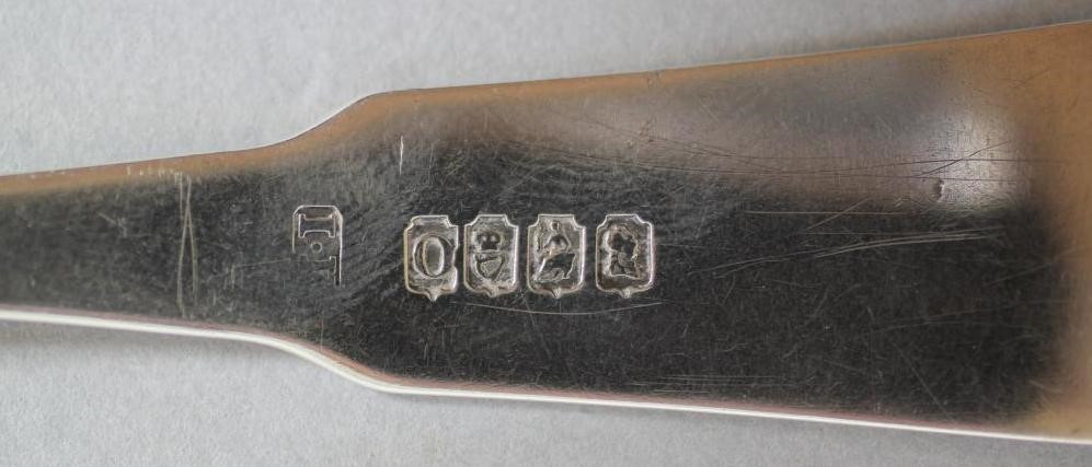 A GEORGE IV SILVER CHEESE SCOOP Image