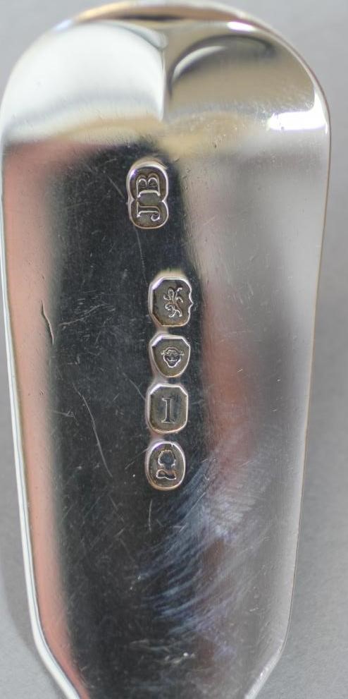 A GEORGE IV SILVER CHEESE SCOOP Image