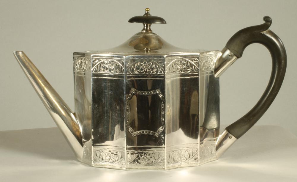 A LATE GEORGE III SILVER TEAPOT Image