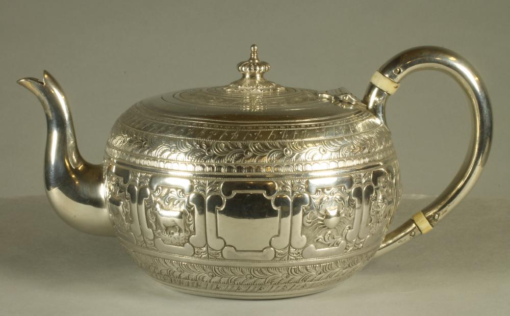 A VICTORIAN SILVER INDIANESQUE TEAPOT Image