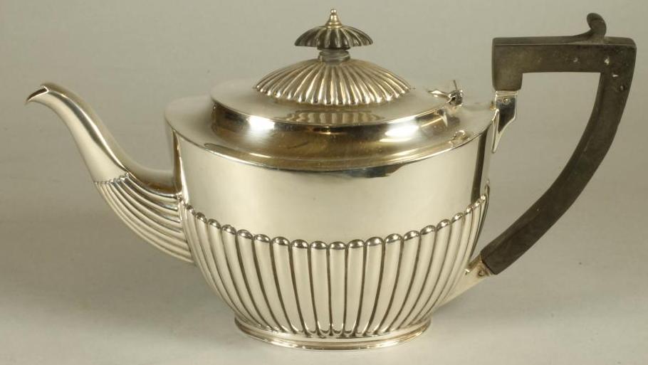 A LATE VICTORIAN SILVER TEAPOT Image