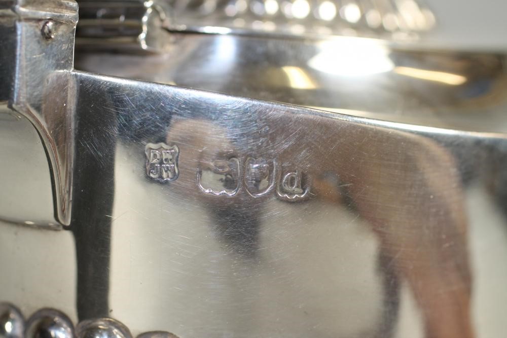 A LATE VICTORIAN SILVER TEAPOT Image