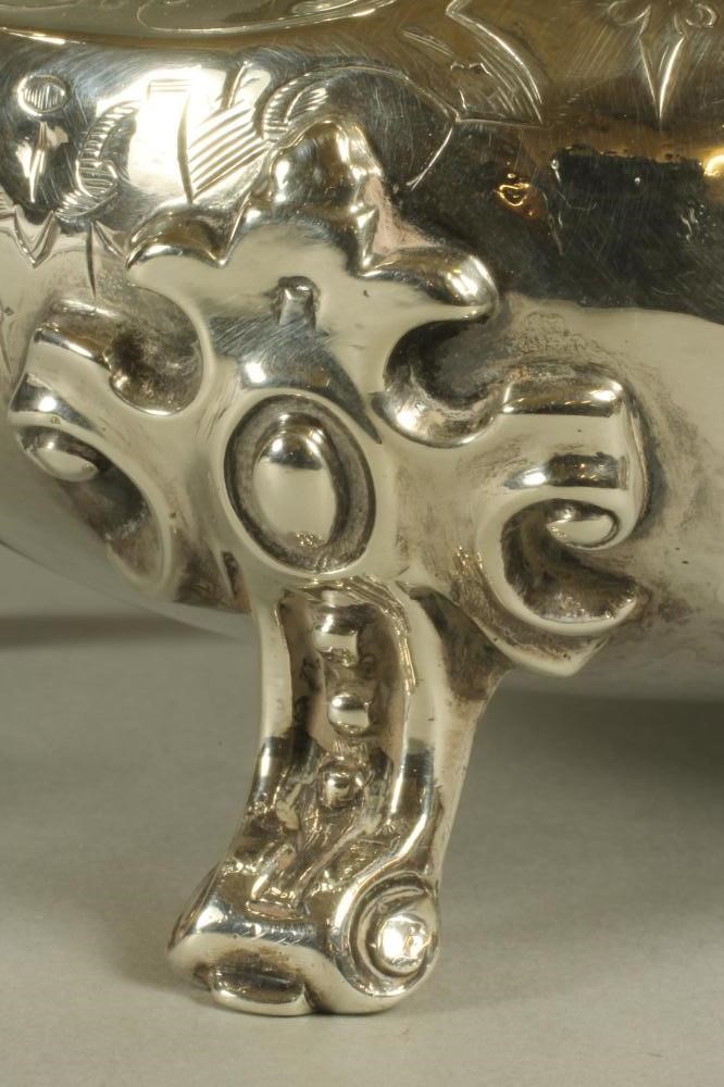 A VICTORIAN SILVER TEAPOT Image