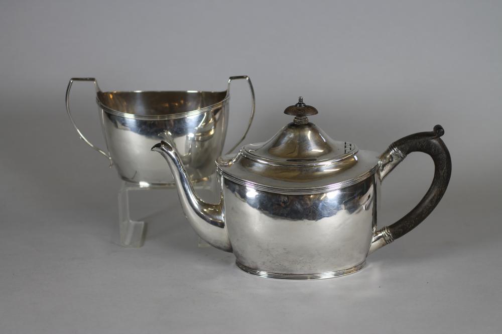 A LATE GEORGE III SILVER TEAPOT AND SUGAR BASIN Image