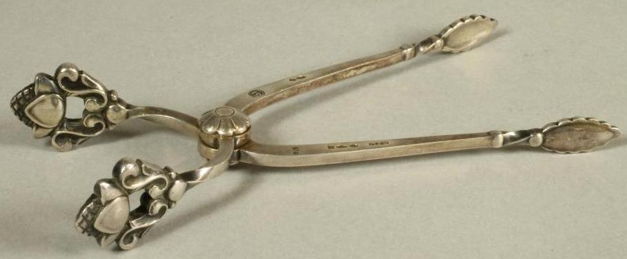 A PAIR OF GEORG JENSEN SILVER SUGAR NIPS Image