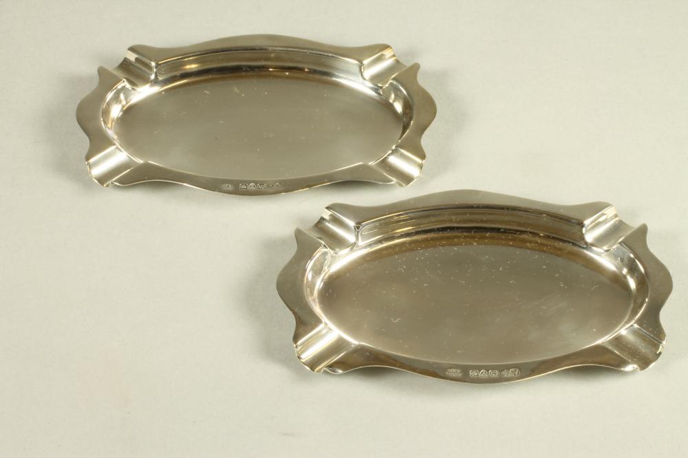 A PAIR OF SILVER ASHTRAYS Image