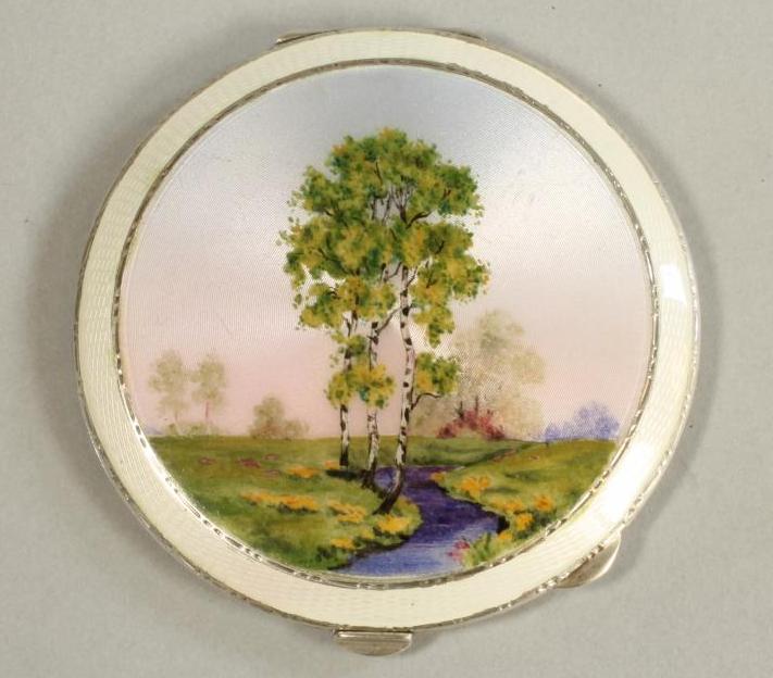 A SILVER COMPACT Image