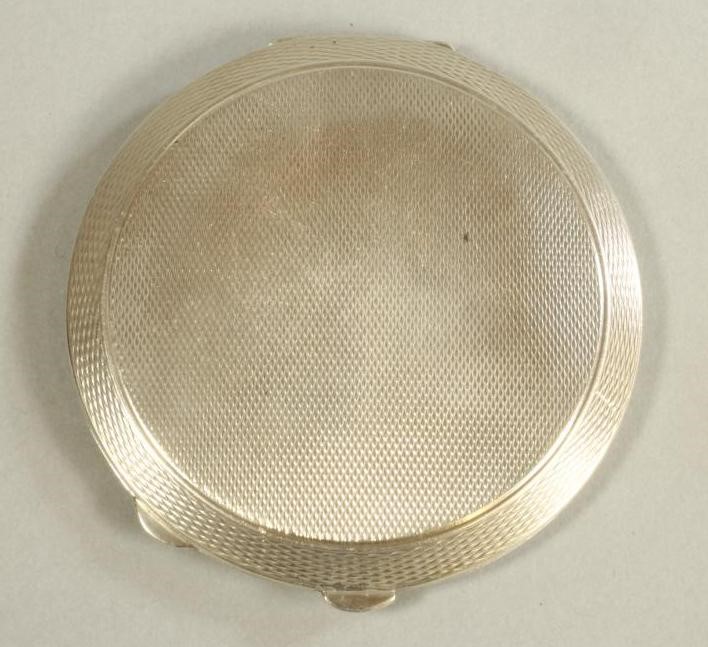 A SILVER COMPACT Image