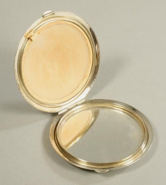 A SILVER COMPACT Image