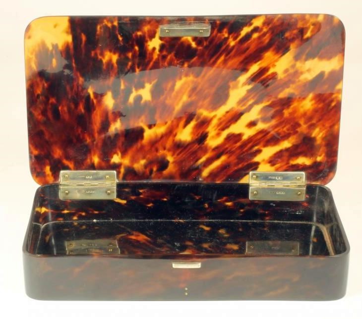 A TORTOISESHELL DRESSING TABLE BOX with silver hinges Image