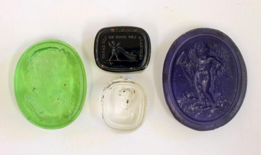 A COLLECTION OF FOUR TASSIE TYPE SEALS comprising an oval transparent green seal depicting a Image