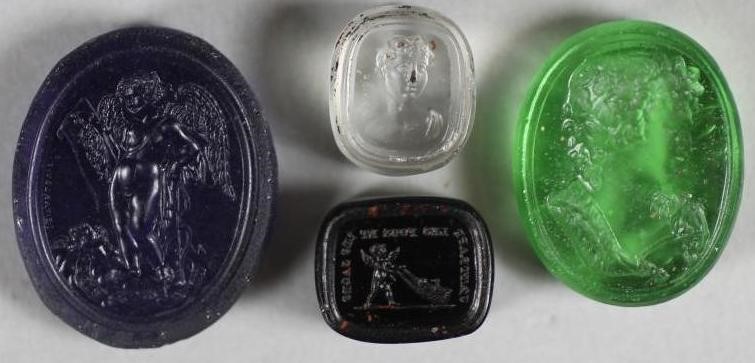 A COLLECTION OF FOUR TASSIE TYPE SEALS comprising an oval transparent green seal depicting a Image