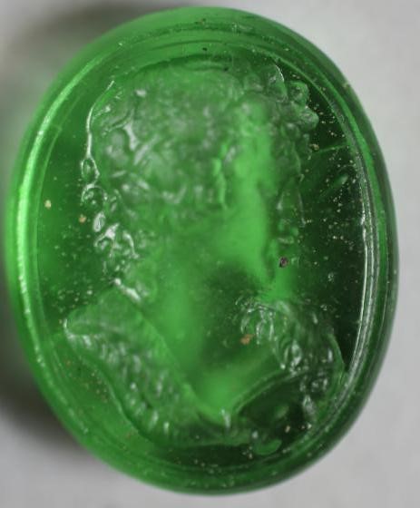 A COLLECTION OF FOUR TASSIE TYPE SEALS comprising an oval transparent green seal depicting a Image