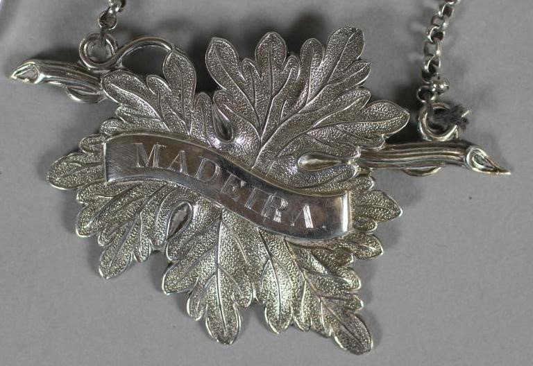 A GEORGE IV SILVER BOTTLE TICKET Image