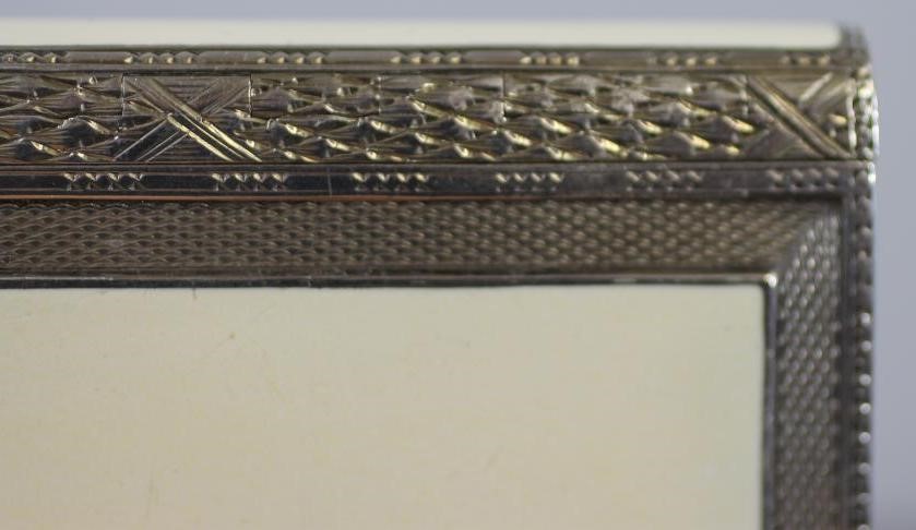 AN ART DECO SILVER AND ENAMEL CIGARETTE CASE Image