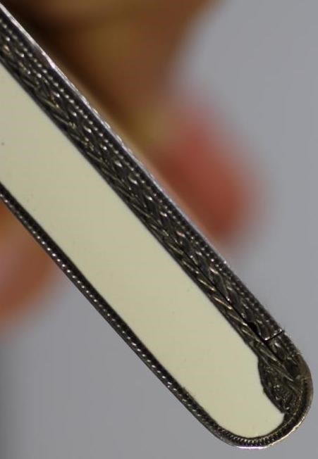 AN ART DECO SILVER AND ENAMEL CIGARETTE CASE Image