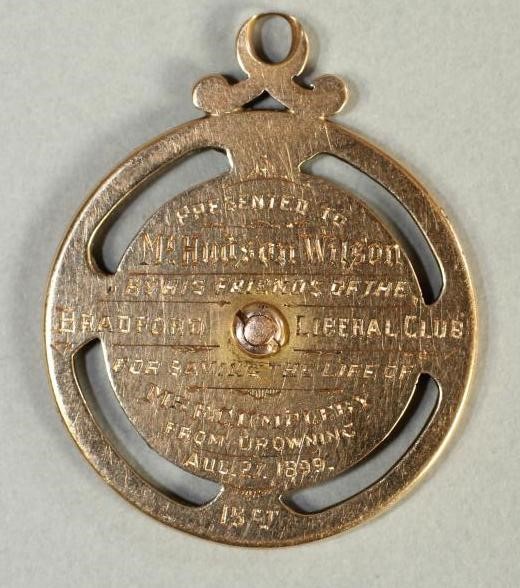 A 15CT GOLD AND ENAMEL MEDALLION Image