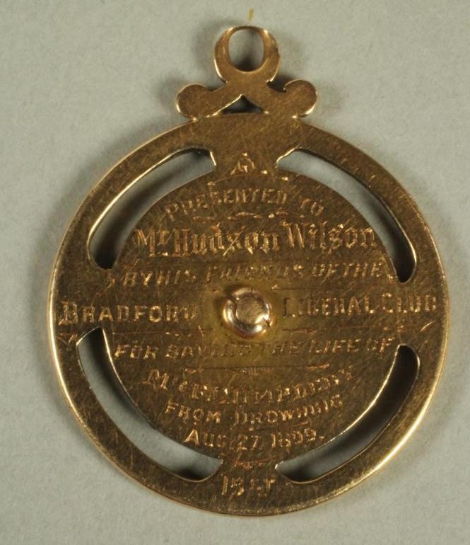 A 15CT GOLD AND ENAMEL MEDALLION Image