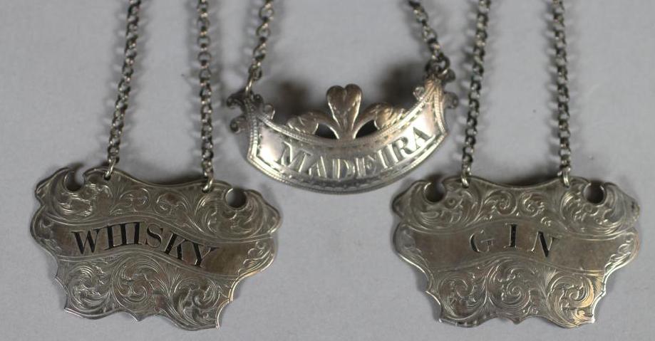 A PAIR OF VICTORIAN SILVER DECANTER LABELS Image