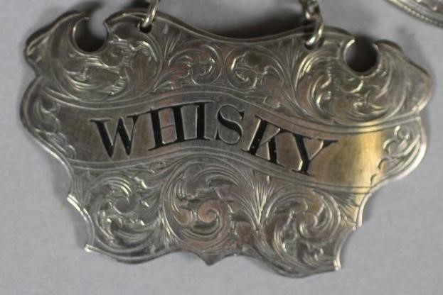 A PAIR OF VICTORIAN SILVER DECANTER LABELS Image