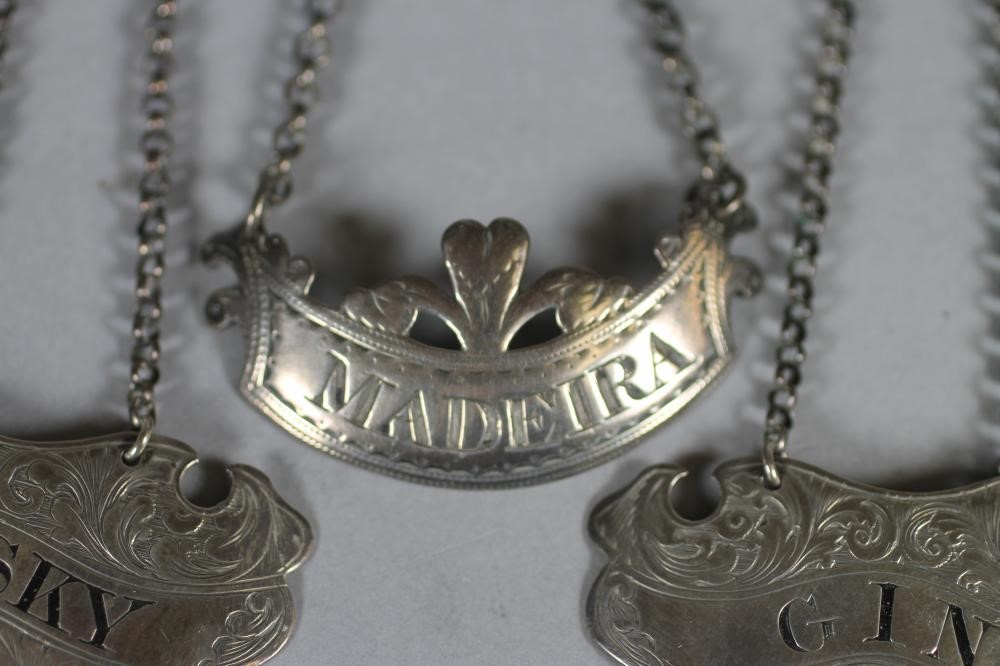 A PAIR OF VICTORIAN SILVER DECANTER LABELS Image