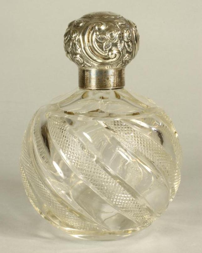 A LATE VICTORIAN GLASS SCENT BOTTLE of wrythen moulded globular form and strawberry cutting Image