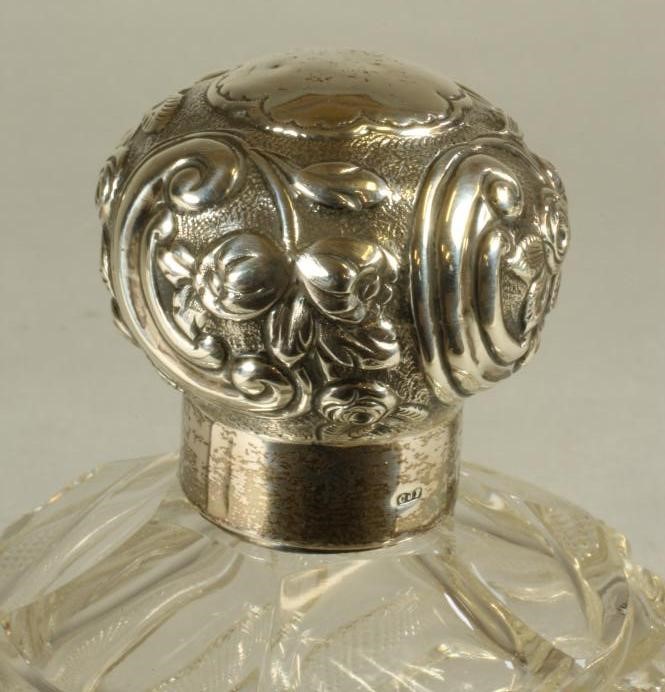 A LATE VICTORIAN GLASS SCENT BOTTLE of wrythen moulded globular form and strawberry cutting Image