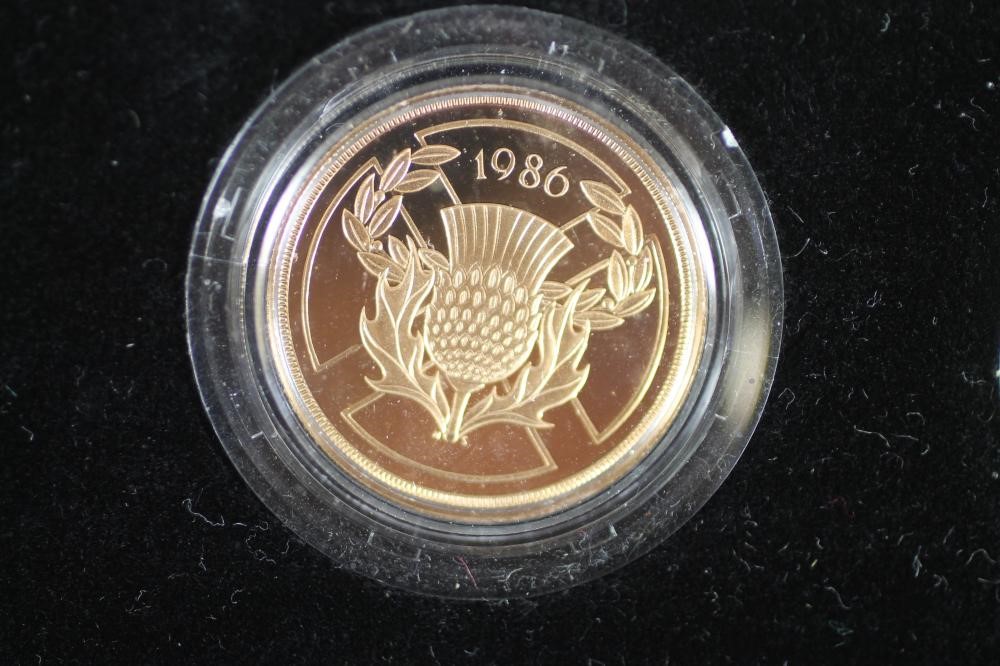 AN ELIZABETH II GOLD THREE COIN PROOF SET Image
