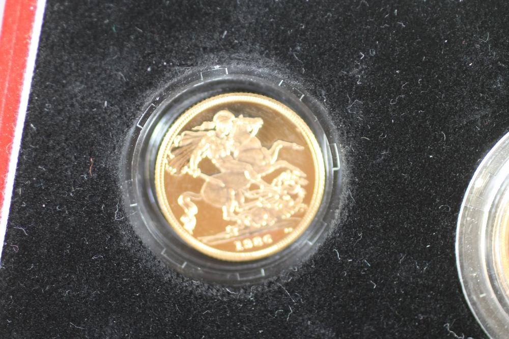 AN ELIZABETH II GOLD THREE COIN PROOF SET Image