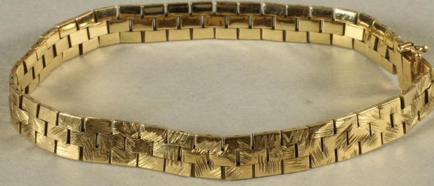 A 9CT GOLD BRACELET of triple brick link form Image