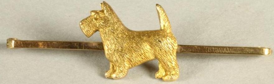 A 9CT GOLD TIE PIN centred by a terrier Image