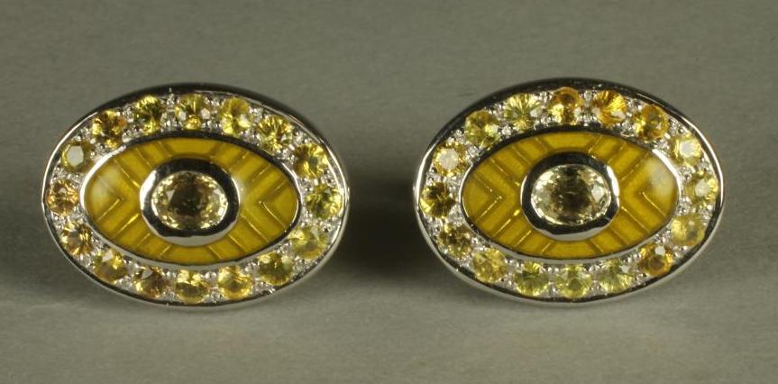 A PAIR OF YELLOW SAPPHIRE SET CUFFLINKS Image