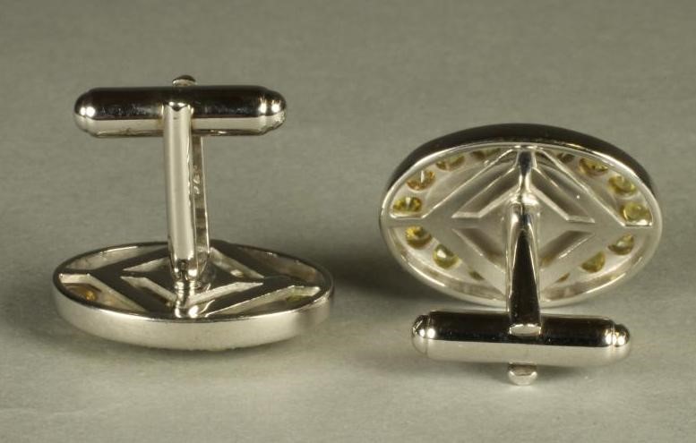 A PAIR OF YELLOW SAPPHIRE SET CUFFLINKS Image