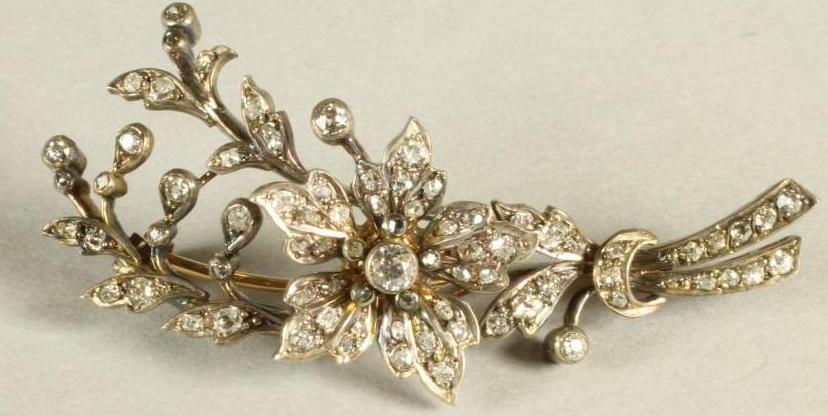 A LATE VICTORIAN DIAMOND FLOWER SPRAY BROOCH with central flowerhead issuing from a ribbon tied Image